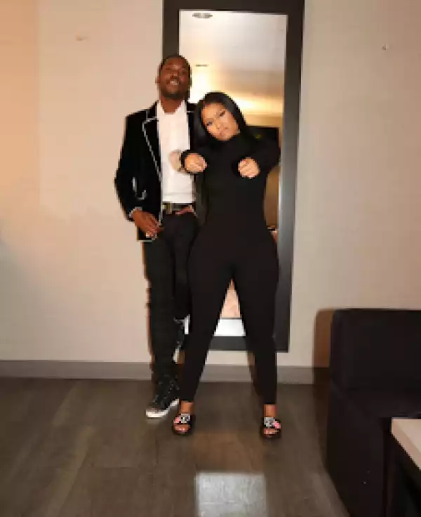 Nicki Minaj poses with a pair of LV slippers gifted to her by Meek Mill
